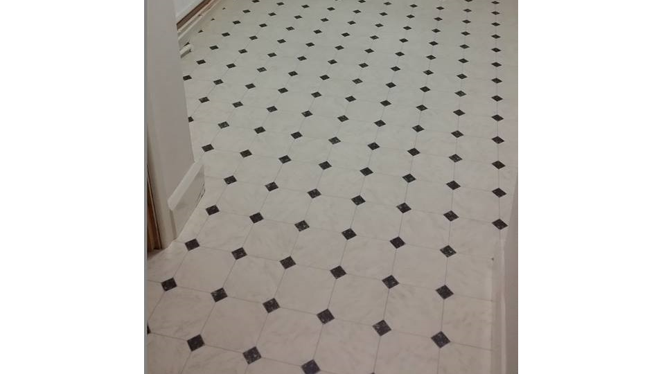 black and white repeating tile effect floor